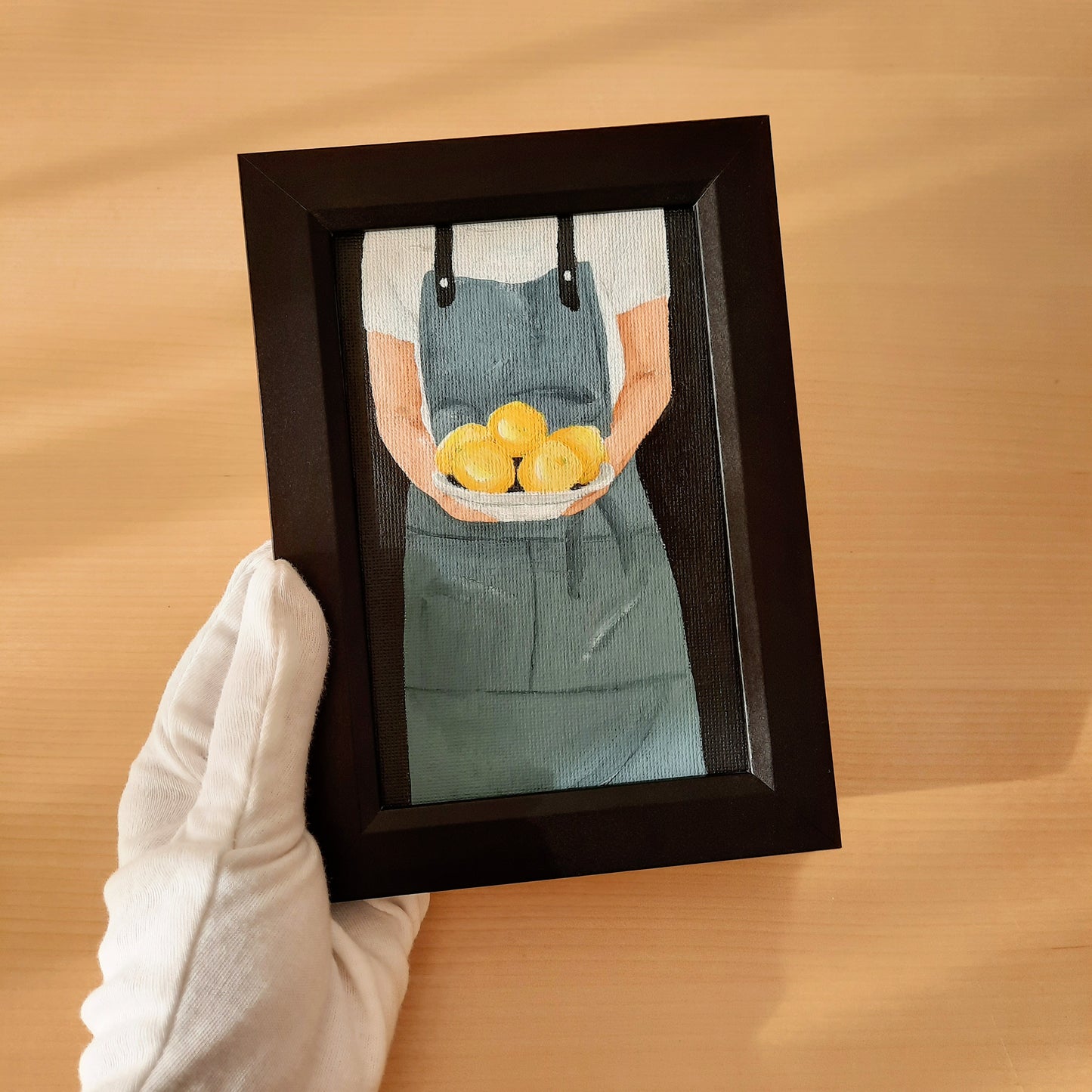 Chef Holding a Plate of Lemons