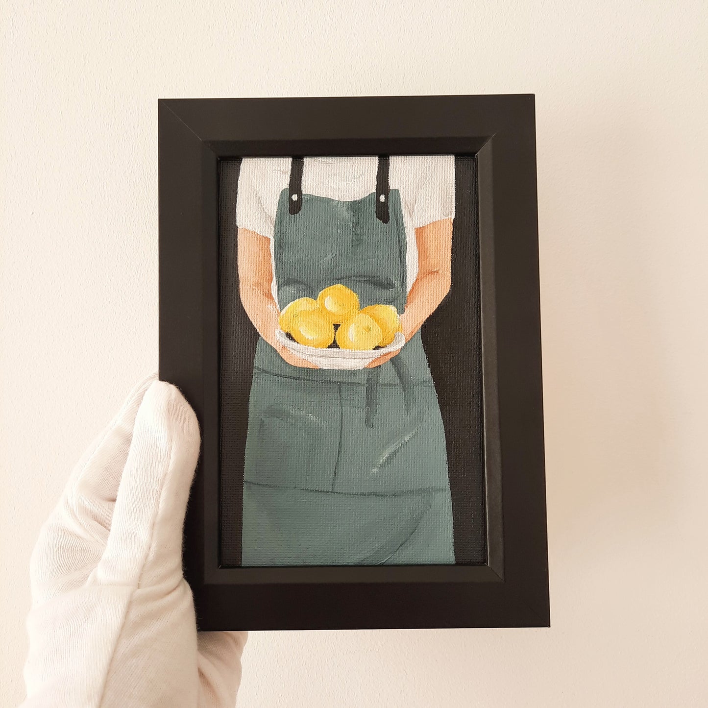 Chef Holding a Plate of Lemons
