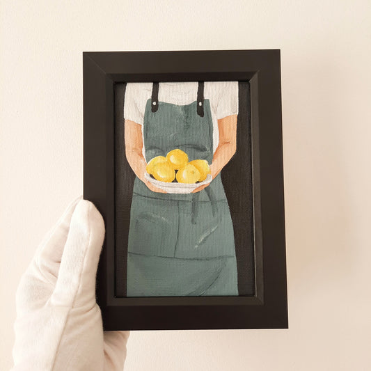 Chef Holding a Plate of Lemons