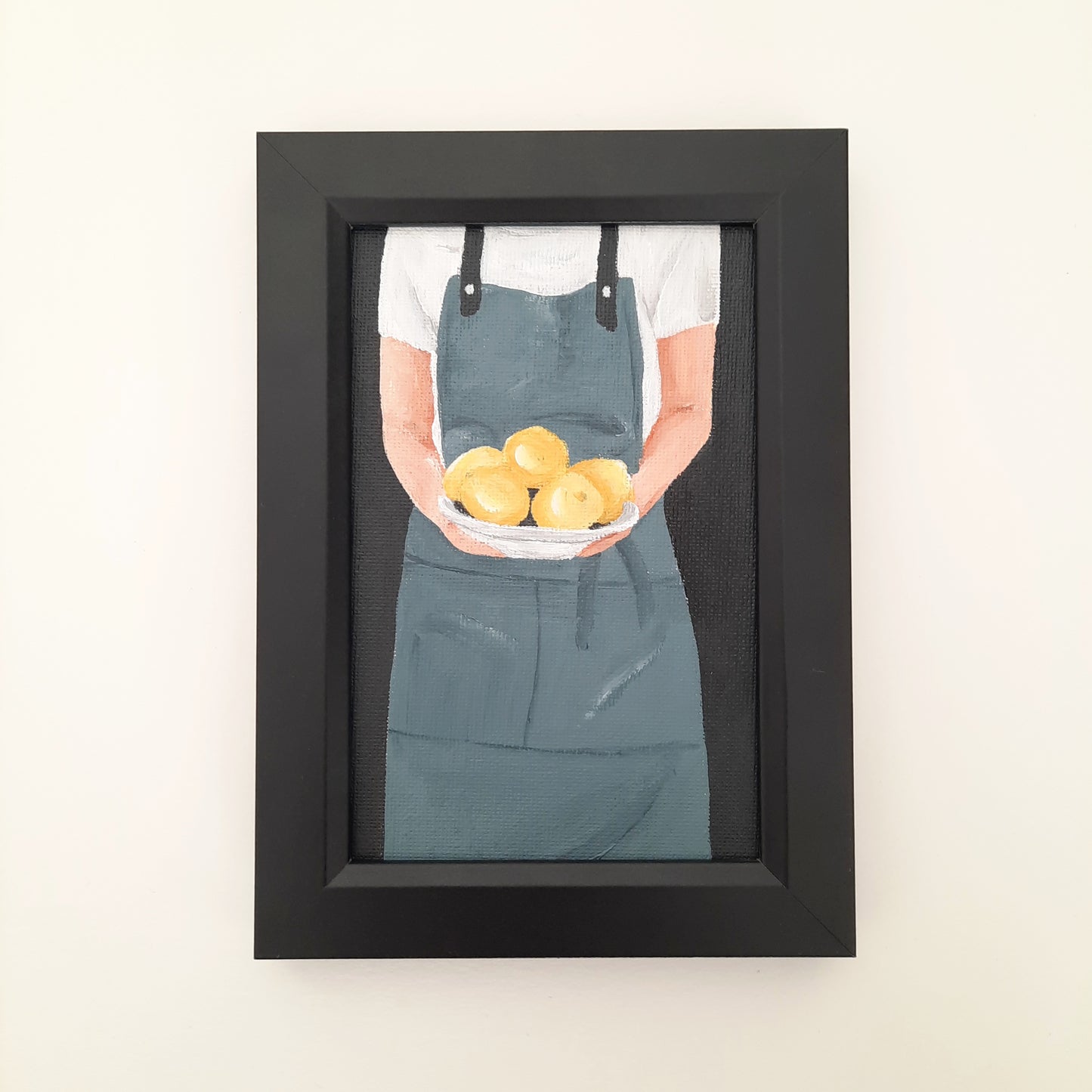 Chef Holding a Plate of Lemons