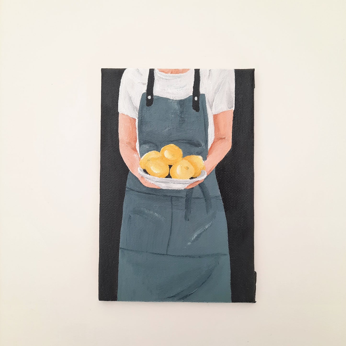 Chef Holding a Plate of Lemons